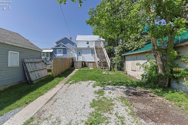 108 Spring St, Willard, OH 44890 - rear view of house featuring stairs
