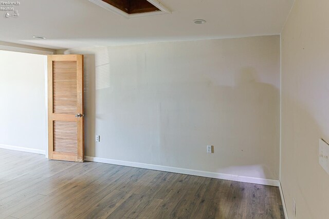 108 Spring St, Willard, OH 44890 - empty room featuring wood finished floors and baseboards