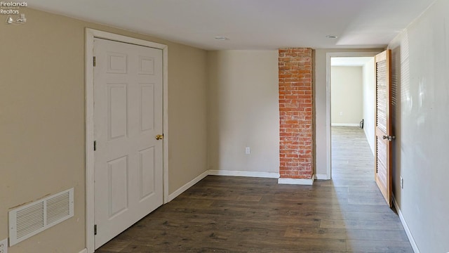 108 Spring St, Willard, OH 44890 - spare room featuring dark wood finished floors and baseboards