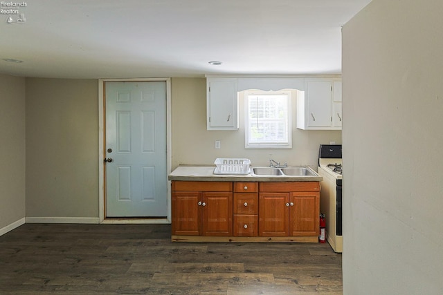 108 Spring St, Willard, OH 44890 - kitchen featuring dark wood-style floors, white cabinets, white gas range oven, and light countertops