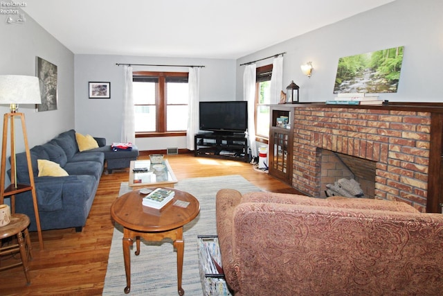 206 Lincoln Dr, Port Clinton, OH 43452 - living room featuring wood finished floors and a fireplace