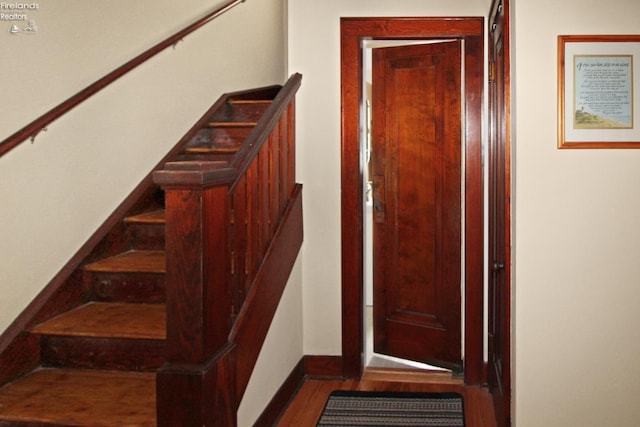206 Lincoln Dr, Port Clinton, OH 43452 - staircase with wood finished floors and baseboards