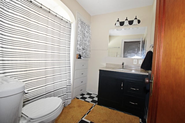 206 Lincoln Dr, Port Clinton, OH 43452 - bathroom featuring toilet, tile patterned floors, and vanity