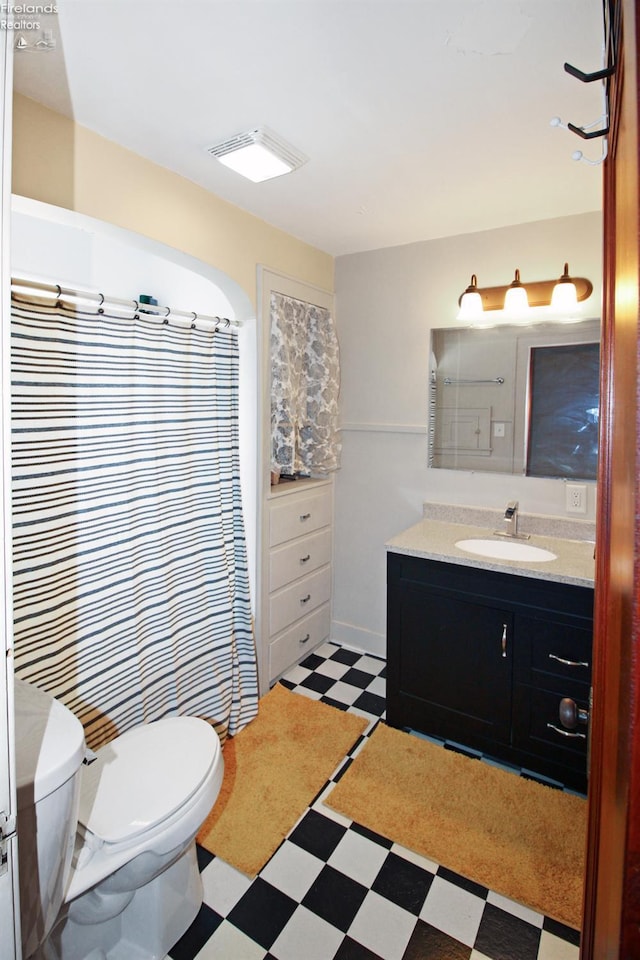 206 Lincoln Dr, Port Clinton, OH 43452 - bathroom featuring tile patterned floors, toilet, and vanity