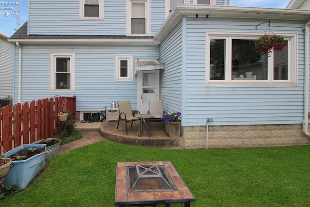 206 Lincoln Dr, Port Clinton, OH 43452 - back of property with a fire pit, a shingled roof, and a patio area
