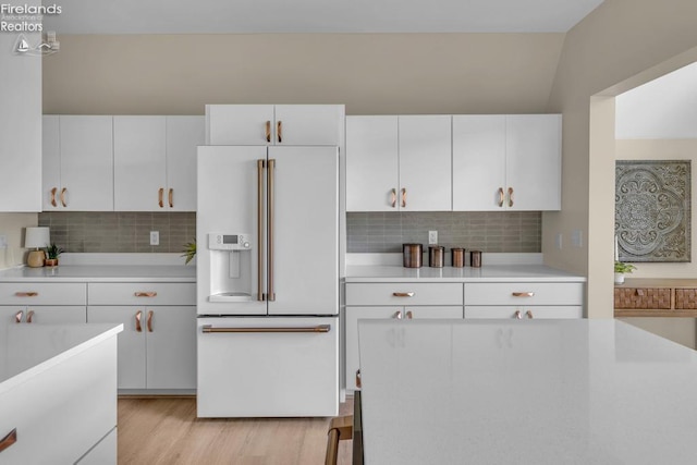 1861 N Opfer Lentz Rd, Martin, OH 43445 - kitchen with high end white fridge, light countertops, tasteful backsplash, and lofted ceiling