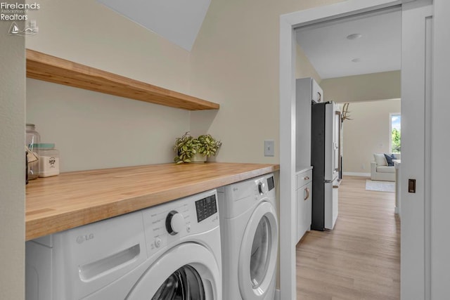 1861 N Opfer Lentz Rd, Martin, OH 43445 - washroom featuring washing machine and dryer and light wood-type flooring