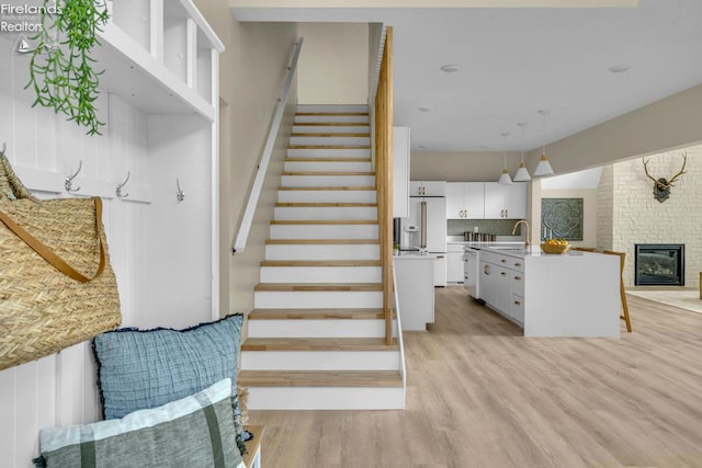 1861 N Opfer Lentz Rd, Martin, OH 43445 - stairs featuring wood finished floors and a fireplace
