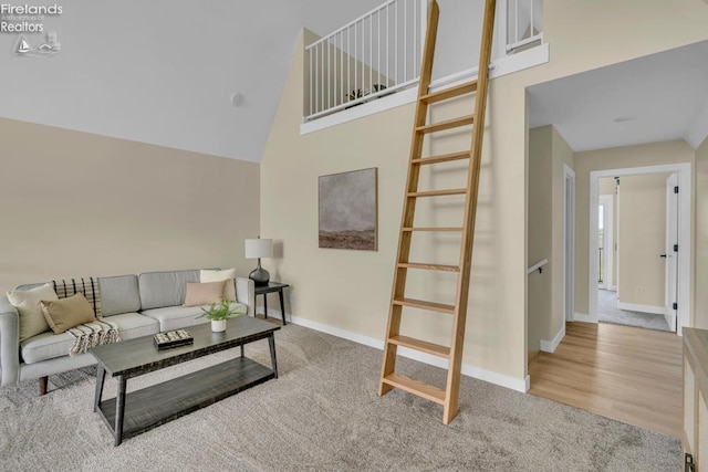 1861 N Opfer Lentz Rd, Martin, OH 43445 - living area featuring carpet floors, a high ceiling, and baseboards