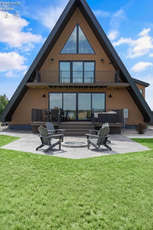 1861 N Opfer Lentz Rd, Martin, OH 43445 - back of property with a patio area, a yard, and a balcony