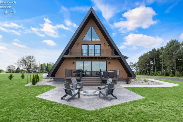 1861 N Opfer Lentz Rd, Martin, OH 43445 - rear view of house with a patio, a balcony, a fire pit, and a lawn