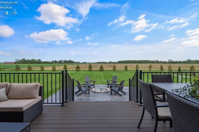 1861 N Opfer Lentz Rd, Martin, OH 43445 - wooden deck with a view of countryside, a yard, outdoor dining area, and an outdoor fire pit