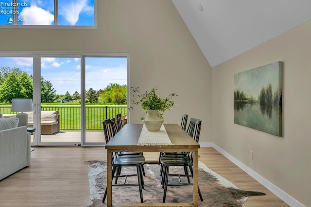 1861 N Opfer Lentz Rd, Martin, OH 43445 - dining area with high vaulted ceiling, baseboards, and wood finished floors