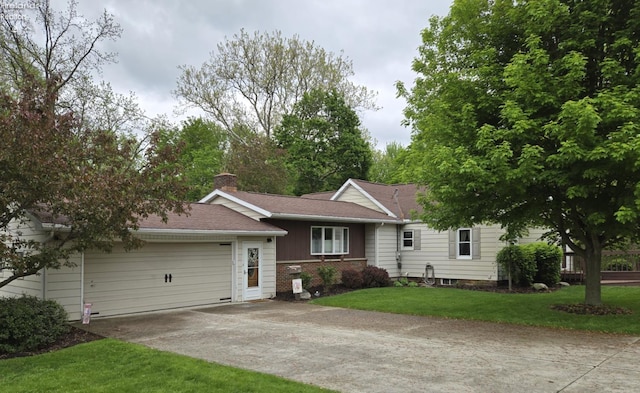 29 Scheiber St, Tiffin, OH 44883 - view of front facade featuring concrete driveway, a chimney, a garage, a front yard, and roof with shingles