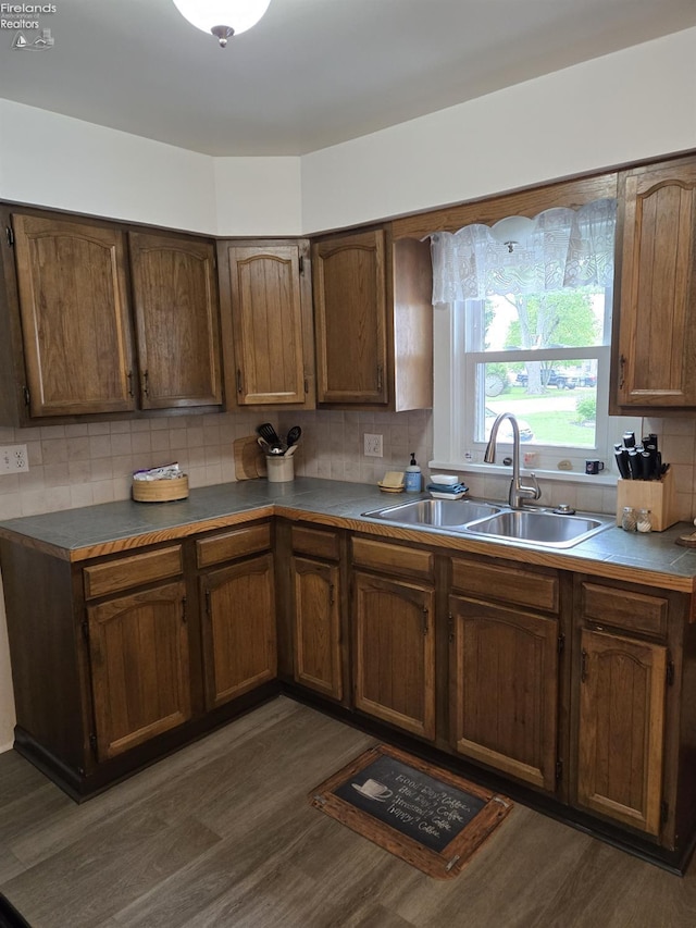 29 Scheiber St, Tiffin, OH 44883 - kitchen featuring a sink, backsplash, and dark wood-type flooring