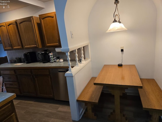29 Scheiber St, Tiffin, OH 44883 - kitchen featuring stainless steel dishwasher, tile countertops, dark wood-type flooring, decorative backsplash, and hanging light fixtures
