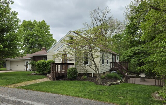 29 Scheiber St, Tiffin, OH 44883 - view of front of property featuring a front yard, a wooden deck, driveway, and a patio