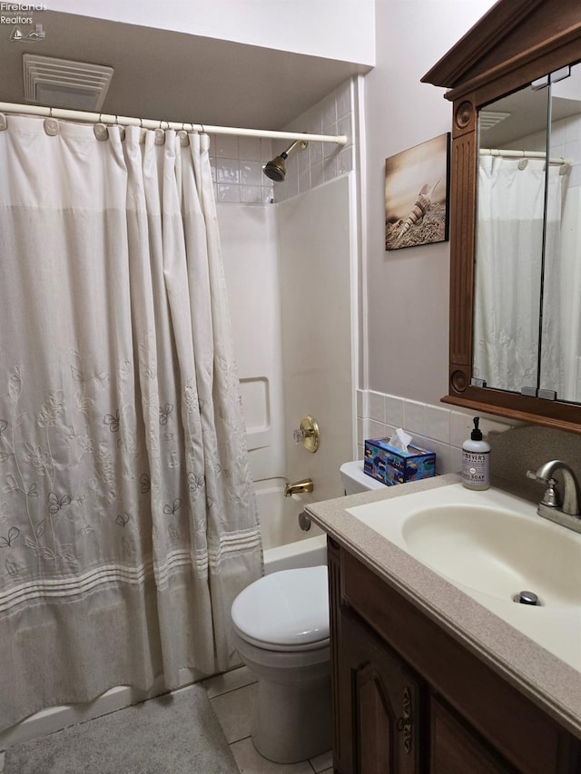 29 Scheiber St, Tiffin, OH 44883 - bathroom with toilet, vanity, tile patterned floors, and shower / bath combo with shower curtain