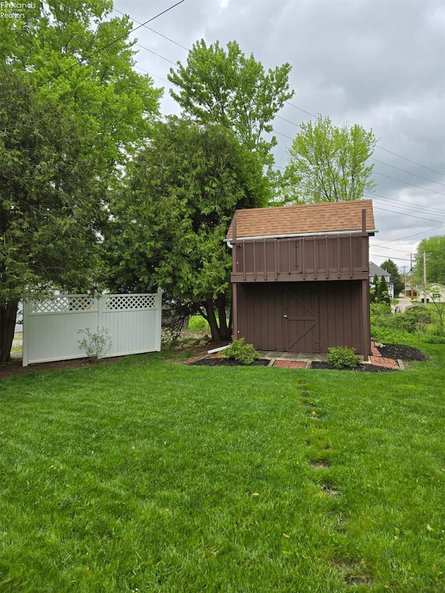 29 Scheiber St, Tiffin, OH 44883 - view of grassy yard with a storage shed and an outdoor structure