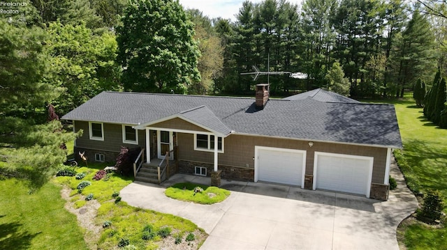 ranch-style house featuring concrete driveway, an attached garage, a chimney, and roof with shingles