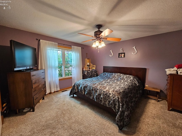 238 Nathan Dr, Clyde, OH 43410 - bedroom featuring light colored carpet, ceiling fan, and a textured ceiling