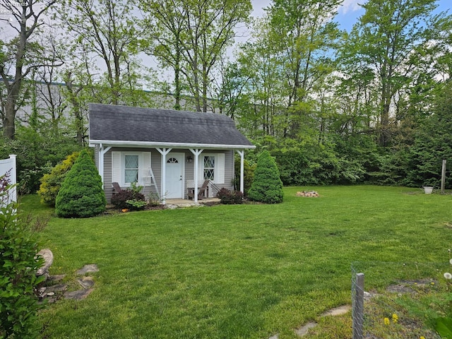 238 Nathan Dr, Clyde, OH 43410 - view of front of property featuring a front lawn and a shingled roof