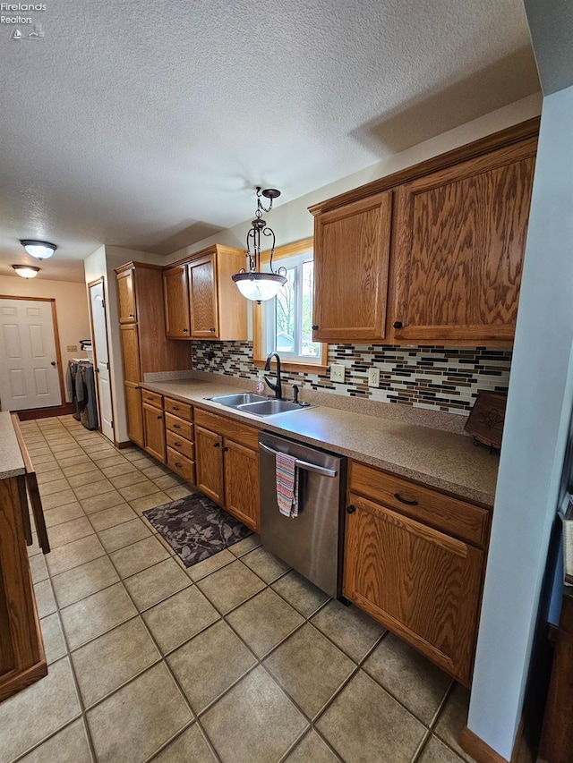 238 Nathan Dr, Clyde, OH 43410 - kitchen with a sink, dishwasher, backsplash, a textured ceiling, and brown cabinets