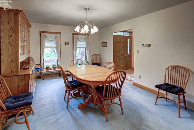 914 Wood Glen Ct, Norwalk, OH 44857 - carpeted dining area featuring a chandelier and baseboards