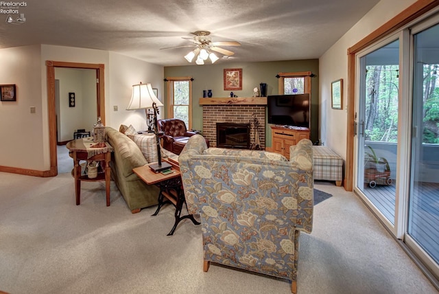 914 Wood Glen Ct, Norwalk, OH 44857 - living area with light carpet, a fireplace, a ceiling fan, and baseboards