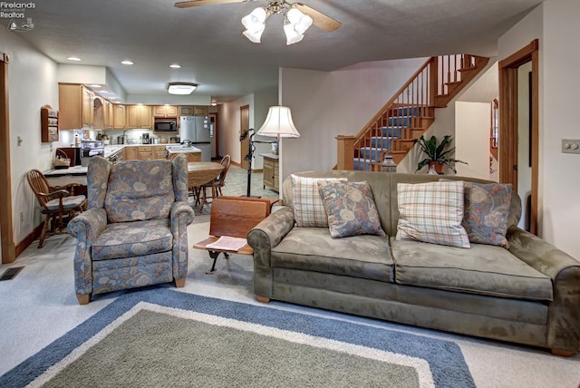 914 Wood Glen Ct, Norwalk, OH 44857 - living area featuring a ceiling fan, light carpet, stairs, recessed lighting, and baseboards