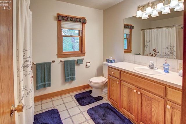 914 Wood Glen Ct, Norwalk, OH 44857 - full bathroom with tile patterned floors, vanity, toilet, and baseboards