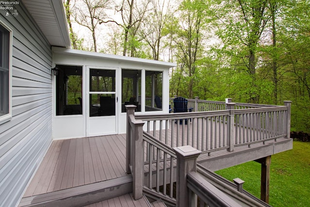 914 Wood Glen Ct, Norwalk, OH 44857 - wooden deck with a sunroom
