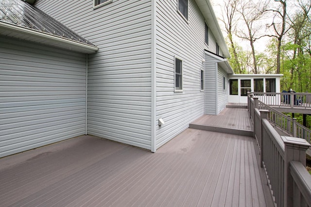 914 Wood Glen Ct, Norwalk, OH 44857 - wooden deck with a sunroom