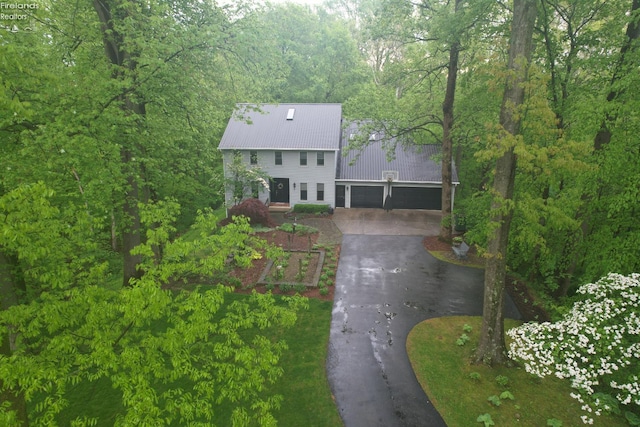 914 Wood Glen Ct, Norwalk, OH 44857 - aerial view of property and surrounding area featuring a heavily wooded area