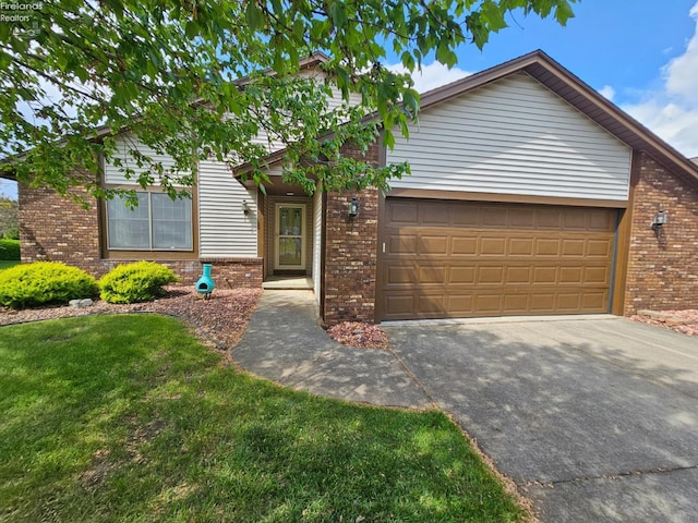 110 Orchard Grove Dr, Clyde, OH 43410 - view of front facade featuring brick siding, driveway, a garage, and a front yard