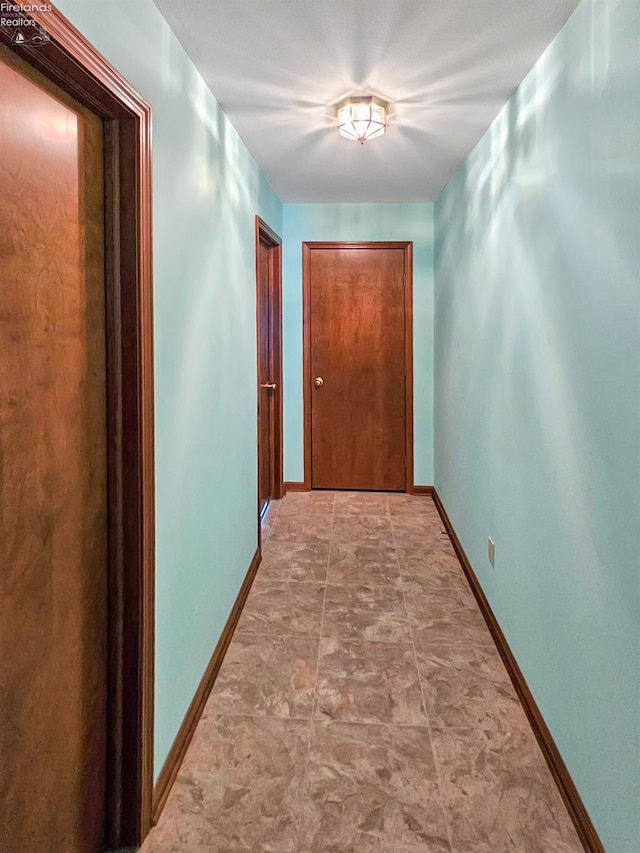 110 Orchard Grove Dr, Clyde, OH 43410 - hall featuring baseboards and stone finish flooring