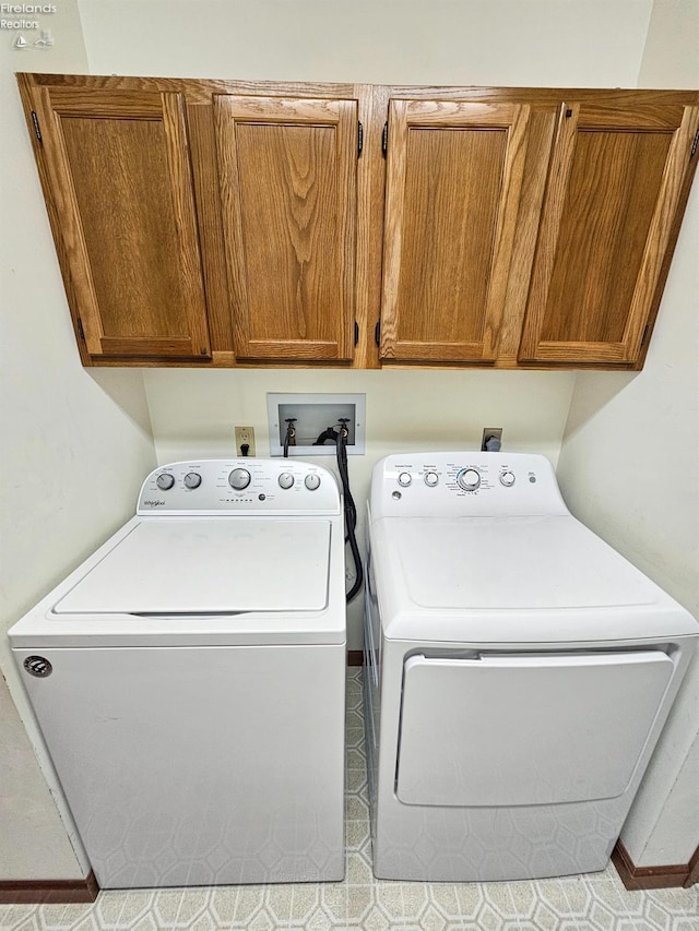 110 Orchard Grove Dr, Clyde, OH 43410 - laundry room with cabinet space and separate washer and dryer