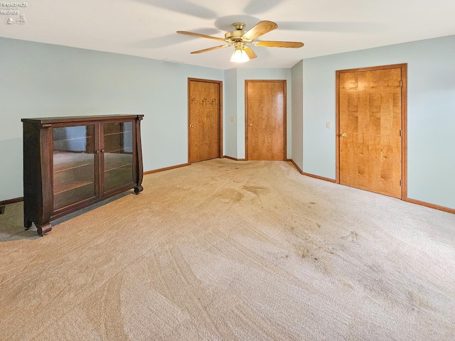 110 Orchard Grove Dr, Clyde, OH 43410 - unfurnished bedroom featuring light colored carpet, baseboards, multiple closets, and ceiling fan