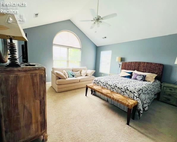 2780 Canterbury Ln Unit A, Port Clinton, OH 43452 - bedroom featuring light colored carpet, vaulted ceiling, and ceiling fan