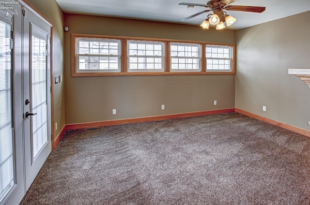 5475 E Mabel Dr, Port Clinton, OH 43452 - empty room featuring healthy amount of natural light, ceiling fan, and carpet flooring