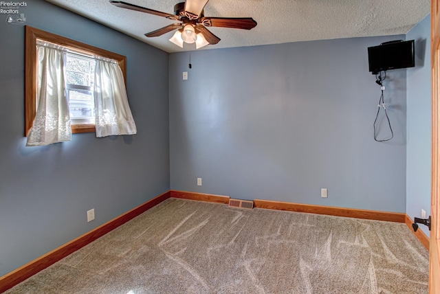 5475 E Mabel Dr, Port Clinton, OH 43452 - carpeted empty room with ceiling fan, a textured ceiling, and baseboards