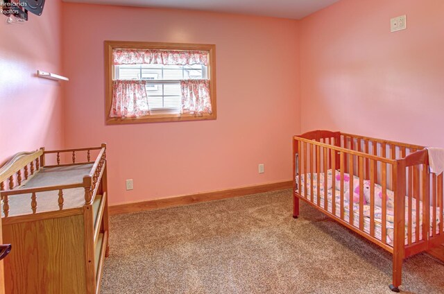 5475 E Mabel Dr, Port Clinton, OH 43452 - bedroom with carpet floors and baseboards