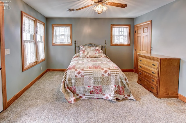 5475 E Mabel Dr, Port Clinton, OH 43452 - bedroom with carpet floors, multiple windows, and baseboards