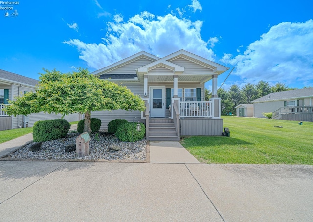 8896 White Crane Way, Oak Harbor, OH 43449 - view of front of house with covered porch and a front yard