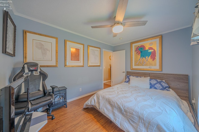 8896 White Crane Way, Oak Harbor, OH 43449 - bedroom with wood finished floors, baseboards, crown molding, and a ceiling fan