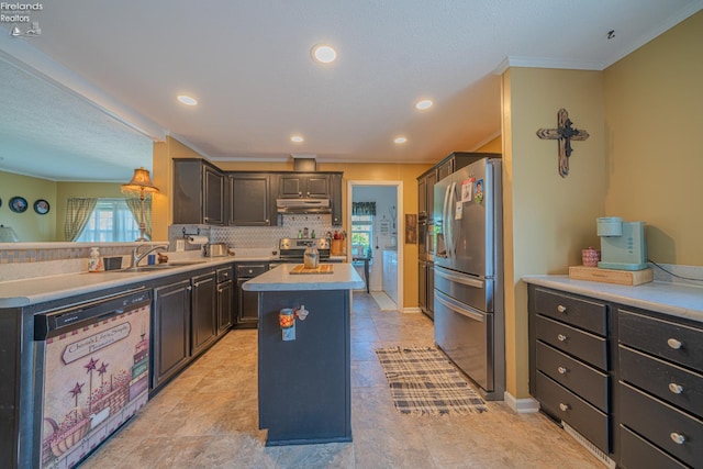 8896 White Crane Way, Oak Harbor, OH 43449 - kitchen with stainless steel appliances, under cabinet range hood, a sink, a kitchen island, and ornamental molding