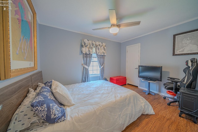 8896 White Crane Way, Oak Harbor, OH 43449 - bedroom with wood finished floors, ornamental molding, baseboards, and a ceiling fan