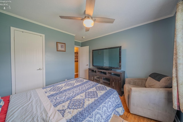 8896 White Crane Way, Oak Harbor, OH 43449 - bedroom with wood finished floors, ornamental molding, and ceiling fan
