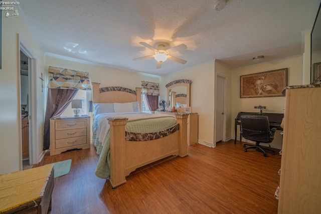 8896 White Crane Way, Oak Harbor, OH 43449 - bedroom featuring wood finished floors, a textured ceiling, an office area, a ceiling fan, and ornamental molding