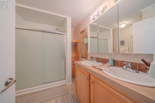 8896 White Crane Way, Oak Harbor, OH 43449 - full bath featuring a stall shower, double vanity, tile patterned flooring, and a textured ceiling